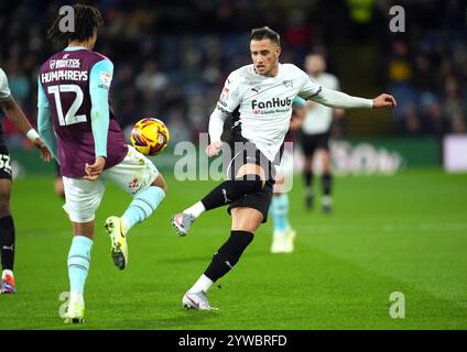 Derby County's Jerry Yates (right) and Burnley's Bashir Humphreys battle for the ball during the Sky Bet Championship match at Turf Moor, Burnley. Picture date: Tuesday December 10, 2024. Stock Photo