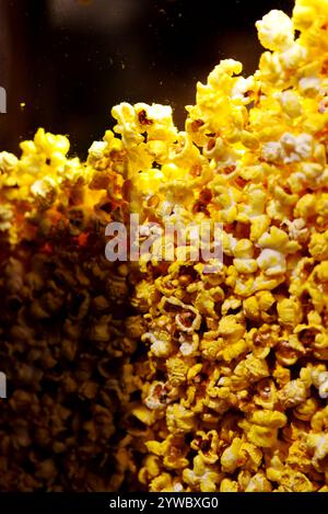 Popcorn in a popcorn machine - close up of popcorn behind a glass container Stock Photo