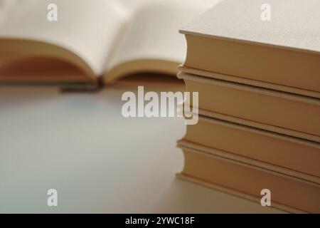 Open blank book on top of stacks of books, Mock up Stock Photo