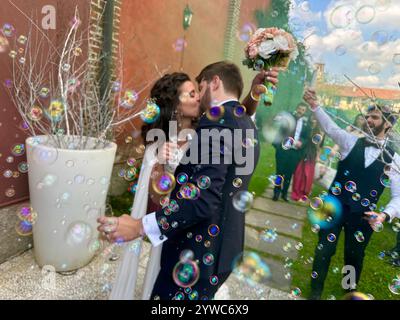 Wedding celebration in Milan Italy with bubbles and colored smoke Stock Photo