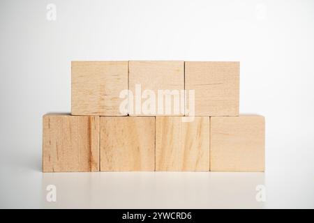 Wooden toys isolated on white background, cubes. Stack of seven wooden blocks. Stock Photo