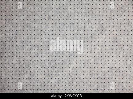 Grey felt material background with dark dots Stock Photo