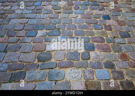 Stone pavement texture. Granite cobblestoned pavement background. Pavement texture Stock Photo