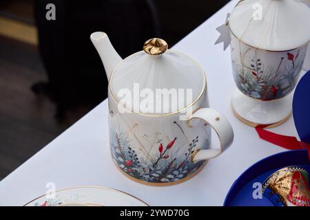 An Elegant and Beautiful Decorative Teapot Featuring a Stunning Floral Design with Gold Accents Stock Photo