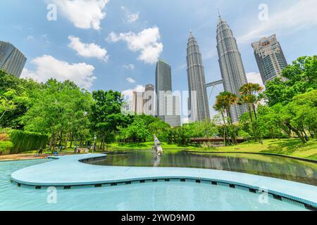 Outdoor swimming pool at the KLCC Park and skyscrapers Stock Photo