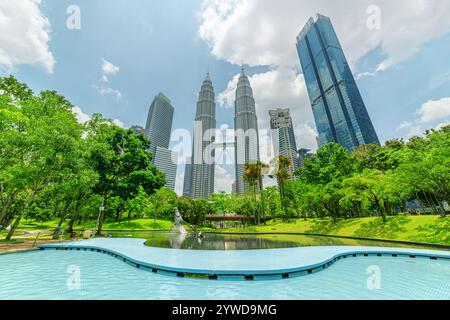 Outdoor swimming pool at the KLCC Park and skyscrapers Stock Photo