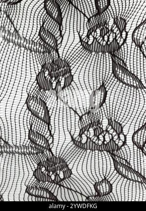 Black nylon flower pattern elasticated micro mesh fabric texture background Stock Photo