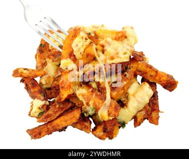 Portion of cheesy dirty fries, fried battered skin on potato chips topped with Monterey jack cheddar cheese Stock Photo
