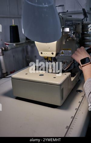 White thread guide in industrial sewing machine for embroidery of ...