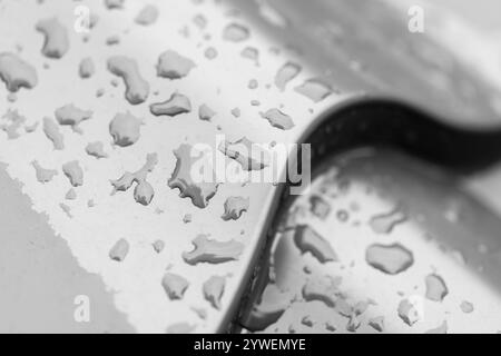 Shiny metal tile roof with raindrops on it, close-up background photo texture Stock Photo