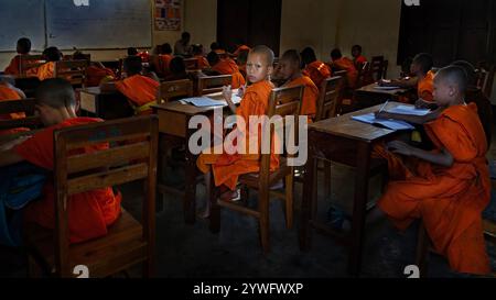 Young buddhist monks in the classroom in the monk's school in Luang Prabang, Laos Stock Photo