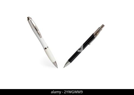 Two roller ball pens standing and  levitating on white background, close up Stock Photo