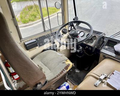 Interior view of an old bus with a damaged seat and dashboard, Alaska, USA, North America Stock Photo