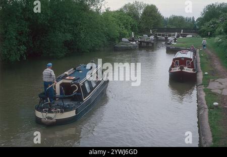 A cold gray day in May at Stockton Locks.   The Stockton flight of 10 locks is on the Grand Union Canal near the historic village of Stockton in Warwickshire.  From the locks, there are stunning views of the surrounding countryside. Stockton Top Marina and The Boat Inn are at the top of the flight and the Blue Lias pub is at the bottom. The Grand Union Canal links London and Birmingham and was completed in the early 19th century.  Stockton Locks are between Napton Junction and the village of Long Itchington. Stock Photo