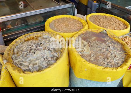 Korean food at Nambu Market in Jeonju, South Korea. Barrels with fermenting fish for jeotgal. Stock Photo