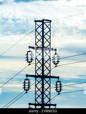 high voltage pylons silhouette cloudy sky background Stock Photo - Alamy