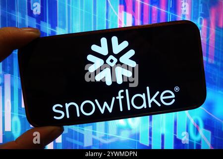 In this photo illustration, the Snowflake company logo is seen displayed on a smartphone screen. Stock Photo