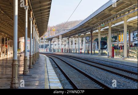 High-resolution interior view of the historic Sirkeci Train Station in Istanbul, showcasing platforms, extending railway tracks, and the architectural Stock Photo