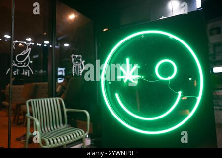 CHIANG MAI, THAILAND - OCTOBER 24, 2023: neon sign as seen at cannabis stall in Chiang Mai at nighttime. Stock Photo