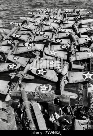 Douglas SBD Dauntlesses on the flight-deck of the USS Enterprise, a World War II American naval scout plane and dive bomber. From 1940 to 1944, the aircraft was the United States Navy's main carrier-based scout/dive bomber and also flown by the United States Marine Corps, both from land air bases and aircraft carriers. An effective naval scout plane and dive bomber with long range, good handling characteristics, manoeuvrability, potent bomb load and great diving characteristics, it's best remembered as the bomber that delivered the fatal blows to the Japanese carriers at the Battle of Midway. Stock Photo