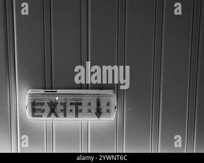 Illuminated Exit Sign: A Path to Escape Stock Photo