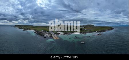 Aerial view of the clear blue sea and houses Scottish island of Iona Scotland UK Inner Hebrides off the Isle of Mull west coast of Scotland a popular Stock Photo