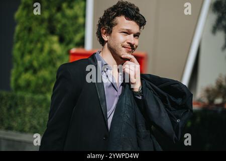 Confident businessman thinking outdoors in a formal suit Stock Photo
