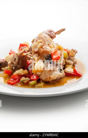 rabbit on vegetables with herbs Stock Photo