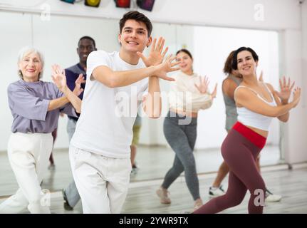 Group of people practicing energetic lindy hop movements Stock Photo