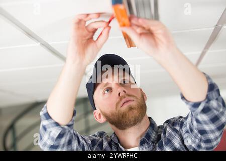 man taking measures with spirit level Stock Photo