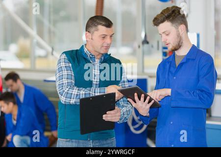 confident engineers working in the factory Stock Photo