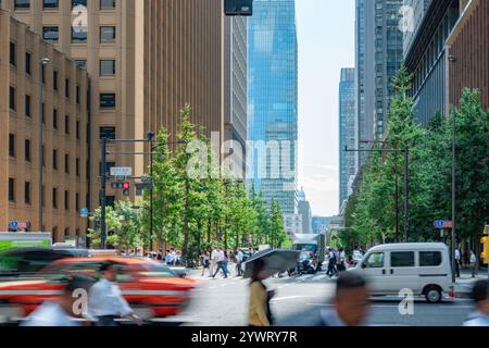 Tokyo office building and pedestrians Stock Photo