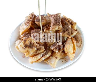 Die cut of roti topped with coco powder and condensed milk on white isolated. Stock Photo