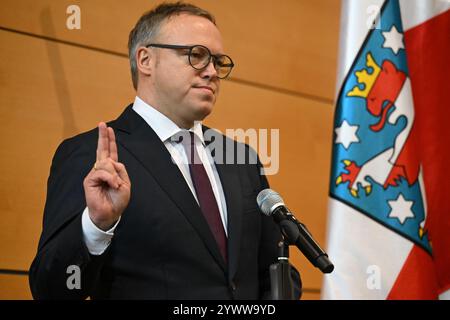 Erfurt, Germany. 12th Dec, 2024. CDU politician Voigt being sworn in as the new Minister President of Thuringia. Voigt has been elected as the new Minister President and leads Germany's first blackberry coalition. Credit: Martin Schutt/dpa/Alamy Live News Stock Photo