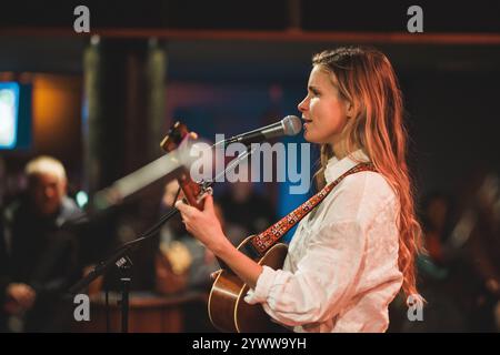 Copenhagen, Denmark. 11th, December 2024. The American singer, songwriter and musician Lydia Luce performs a live concert at Ideal Bar in Copenhagen. Stock Photo