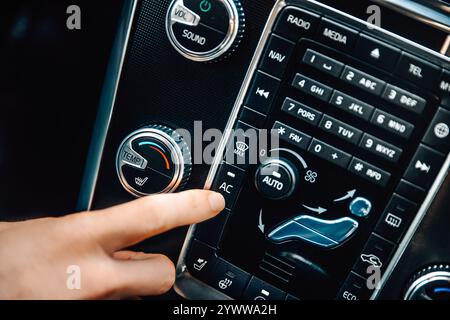 Air conditioning in the car. Switching on the air conditioning button. Malfunction, repair, service Stock Photo