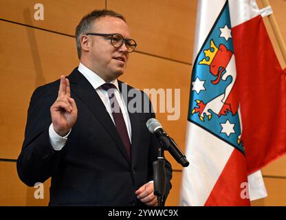 Erfurt, Germany. 12th Dec, 2024. CDU politician Mario Voigt at his swearing-in ceremony as the new Minister President of Thuringia. Voigt has been elected as the new Minister President and leads Germany's first blackberry coalition. Credit: Martin Schutt/dpa/Alamy Live News Stock Photo