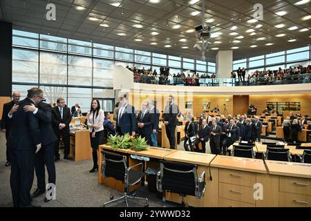 Erfurt, Germany. 12th Dec, 2024. Mario Voigt (CDU, l), is congratulated by MPs. Voigt has been elected as the new Minister President and leads Germany's first blackberry coalition. Credit: Martin Schutt/dpa/Alamy Live News Stock Photo