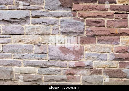 Red Stone Wall Texture - Natural Rock Surface Background for Design. Stock Photo