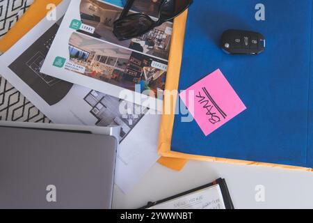 A blue folder with pink writing on it and a pink sticky note on top of it Stock Photo