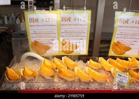 Fresh Japanese red  melon pieces for sale at the Tsukiji Outer Market in Tokyo,chuo City, Japan, Asia. Stock Photo