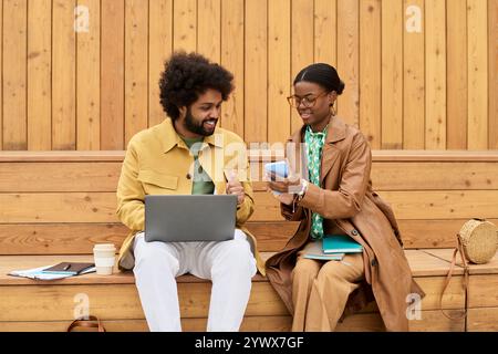 Collaborating and Sharing Ideas Outdoors on Wooden Bench Stock Photo