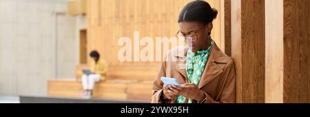 Woman Using Smartphone in Modern Indoor Space Stock Photo