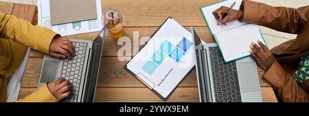 Collaborating on Project With Laptops and Notebooks Stock Photo