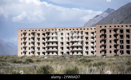 Panorama, Abandoned destroyed buildings in mountain landscape, Soviet apartment blocks, ghost town, Engilchek, Tian Shan, Kyrgyzstan, Asia Stock Photo