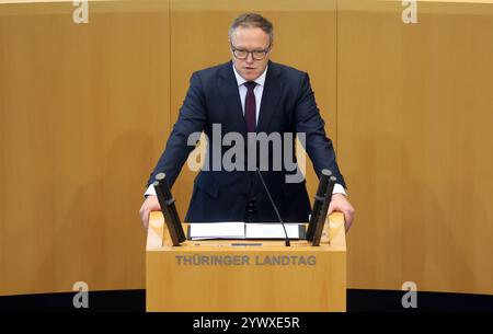 Erfurt, Germany. 12th Dec, 2024. Mario Voigt, the new prime minister of the German region of Thuringia, addresses the regional parliament after his appointment. Credit: Bodo Schackow/dpa/Alamy Live News Stock Photo