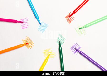 Colored markers on a white background with colored lines and copy space Stock Photo