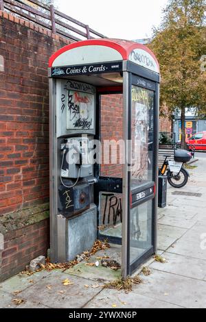a-bt-public-telephone-box-covered-with-graffiti-in-junction-road