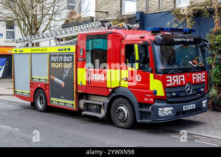 A London Fire Brigade fire engine parked by the roadside in North Islington, London, UK Stock Photo