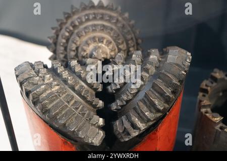 Drill bits. Perforator button for water wells. Tricone bit. Equipment for water and coal wells. Drilling three cone. Stock Photo